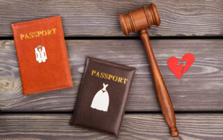 Marriage contract divorce concept. Gavel with passports and broken heart.