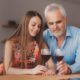 Remove BG Save Share Sample Grandfather with his granddaughter drinking wine